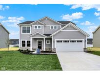 Charming two-story home featuring a two-car garage, stone accents, and a well-manicured lawn at 3727 Thomas Jefferson Ct, Westfield, IN 46074