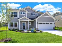 Charming two-story home featuring a manicured lawn, two-car garage, and stylish gray siding at 3727 Thomas Jefferson Ct, Westfield, IN 46074