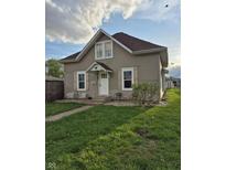Charming home featuring a well-kept lawn, decorative shutters, and a welcoming front entrance at 422 Hege Ave, Columbus, IN 47201