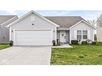 Charming single-story home with a two-car garage and well-maintained lawn at 9157 Tansel Crk Dr, Indianapolis, IN 46234