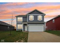 Charming two-story home with gray siding, white trim, attached two-car garage, and a vibrant sunset at 1862 Downey Ln, Greenfield, IN 46140