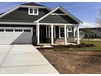 New construction home featuring a two-car garage, stylish trim and stone accents at 19113 River Jordan Pass, Westfield, IN 46074