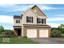 Charming two-story home features a brick facade, attached two-car garage, and well-manicured lawn at 3078 Creekridge Ct, Columbus, IN 47201