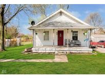 Charming single-story home with a cozy front porch and well-maintained lawn at 3414 Arbor Ave, Indianapolis, IN 46217
