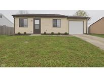 Charming single-story home featuring a well-manicured lawn and an attached garage at 3648 Valley Lake Dr, Indianapolis, IN 46227