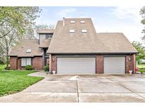 Charming two-story home with a three-car garage, brick accents, and a well-maintained front lawn at 5298 Royal Troon Way, Avon, IN 46123