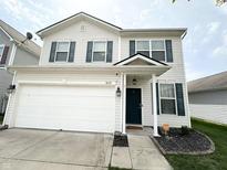 Charming two-story home featuring a well-maintained yard, a two-car garage, and classic curb appeal at 8333 Sansa St, Indianapolis, IN 46113