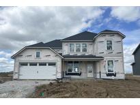 Exterior of a two-story home with a white garage door and covered porch in the construction phase at 16453 Alps Rd, Noblesville, IN 46060