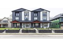 Modern two-story townhouse with black and white siding and a small front yard at 2232 Central Ave, Indianapolis, IN 46205