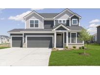 Charming two-story home featuring a two-car garage and beautiful landscaping with a well-manicured lawn at 5804 Summertree Pl, Whitestown, IN 46052