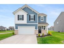 Charming two-story home with blue siding, white accents, a well-manicured lawn, and an attached two-car garage at 8694 Moyer Pl, Pendleton, IN 46064