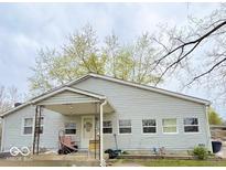 Charming single story home with covered front porch and well-maintained lawn at 13346 N Miller Dr, Camby, IN 46113