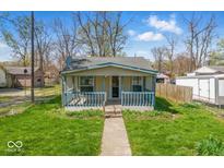 Charming single-story home featuring a cozy front porch and well-maintained lawn at 3346 S Lockburn St, Indianapolis, IN 46221