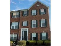 Charming brick townhouse featuring multiple windows and shutters at 3476 Golden Gate N Dr, Carmel, IN 46074