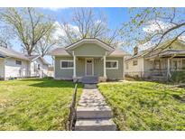 Charming single-Gathering home with a well-maintained lawn and inviting front porch at 525 S Keystone Ave, Indianapolis, IN 46203