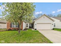 Charming single-Gathering home with a well-manicured lawn and attached two-car garage at 6328 Dusty Laurel Dr, Whitestown, IN 46075