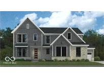 Charming two-story home featuring stone accents, gray siding, large windows, and a welcoming front door at 11808 Sage Creek Bnd, Fishers, IN 46037