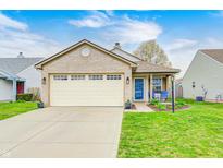 Charming single-story brick home featuring a well-manicured lawn, attached garage, and inviting curb appeal at 1614 Ashley Dr, Lebanon, IN 46052
