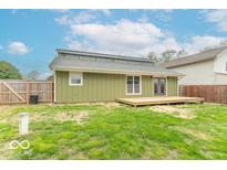 The back exterior reveals a freshly painted facade, a cozy deck, and a well-maintained yard at 7748 S State Road 39, Clayton, IN 46118