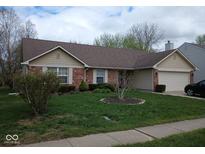 Charming single-story brick home with a well-manicured lawn and attached garage at 8106 Captain Dr, Avon, IN 46123