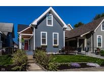 Charming home with a welcoming front porch and well-manicured landscaping at 1626 S Delaware St, Indianapolis, IN 46225