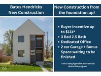 New construction home boasts a modern design with sleek lines and a well-manicured lawn at 315 E Minnesota St, Indianapolis, IN 46225