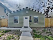 Charming home featuring a freshly painted exterior, new walkway, and manicured landscaping, creating curb appeal at 334 N Chester Ave, Indianapolis, IN 46201