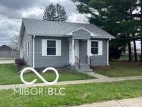 Charming single-story home with gray siding, well-maintained lawn, and inviting front entrance at 517 Dicks St, Lebanon, IN 46052