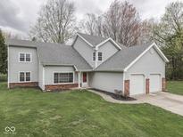 Traditional two-story home with attached two-car garage and well-maintained front lawn at 8160 Bold Forbes Ct, Indianapolis, IN 46217