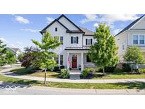 Charming two-story home featuring a welcoming porch and a beautifully landscaped front yard at 1614 Waterleaf Dr, Westfield, IN 46074