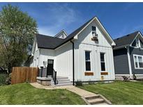 Charming home featuring a modern farmhouse style, a manicured lawn, and a welcoming front entrance at 1818 Orleans St, Indianapolis, IN 46203