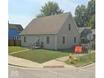 Charming two-story home with a well-maintained lawn on a corner lot at 205 S 8Th St, Noblesville, IN 46060