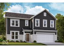 Charming two-story home featuring black siding, white brick accents, and a two-car garage, blending traditional and modern design elements at 7319 Deerberg Dr, Indianapolis, IN 46259