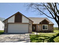 Charming single-story home featuring a brick facade, attached garage, and well-maintained front lawn at 12731 Slippery Rock Rd, Indianapolis, IN 46236