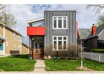Modern two-story home featuring gray siding, a red balcony, and a well-manicured front yard at 1430 Fletcher Ave, Indianapolis, IN 46203