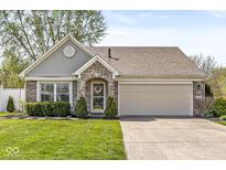 Charming single-story home with a brick-accented entrance, attached garage, and well-manicured lawn at 47 Thornburg Pkwy, Brownsburg, IN 46112