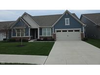 Charming two-story home featuring blue siding, a well-manicured lawn, and an attached two-car garage at 5269 Parkhurst Xing, McCordsville, IN 46055