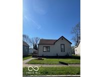 Charming single-story home with a well-maintained lawn and classic architectural details at 833 W Franklin St, Shelbyville, IN 46176