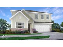 Inviting two-story home with a two-car garage, brick accents, and lush landscaping at 965 Penrose Pl, Danville, IN 46122