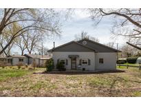 Charming single-story home with a well-maintained exterior, windows, and mature trees at 218 Miami Dr, Noblesville, IN 46062