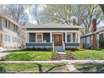 Charming single Gathering home with a well maintained lawn and inviting front porch at 5619 Carrollton Ave, Indianapolis, IN 46220
