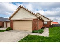 Charming one-story home with a brick exterior and a well-maintained lawn in a suburban neighborhood at 8116 Heritage Commons Dr # Bldg 24, Indianapolis, IN 46219