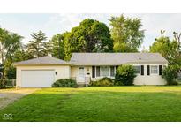 Charming single-story home with a well-maintained lawn and attached garage at 126 Mercator Dr, Greenwood, IN 46143