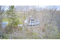 Unique home with a deck among the trees, offering privacy and a secluded feel at 1907 N Washington St, Danville, IN 46122