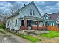 A charming two-story home with a brick porch and traditional architectural details at 359 W 26Th St, Indianapolis, IN 46208