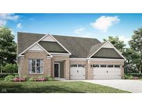 Charming brick home featuring a two-car garage and landscaped front yard, perfect for suburban living at 5095 Astor Way, McCordsville, IN 46055