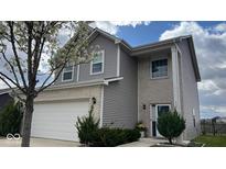 Charming two-story home featuring brick and vinyl siding with an attached two car garage at 530 Farnham Dr, Westfield, IN 46074