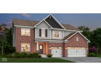Charming two-story brick home showcasing attached two car garage, lush landscaping and well manicured lawn at 5311 Pelion Pl, McCordsville, IN 46055