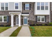Charming townhome exterior featuring stone accents, two-story facade, and inviting front doors at 5964 Lomita Ave, Plainfield, IN 46168