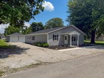 Charming single-story home features a detached garage and updated siding at 103 N Nebraska St, North Salem, IN 46165
